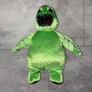 Green Plush Toy with Black Stitching